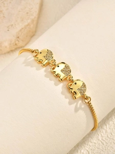 Macro detail of golden elephant bracelet with pavé-set zircons and adjustable chain