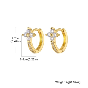 Detailed view of gold flower earrings with clear cubic zirconia and size dimensions