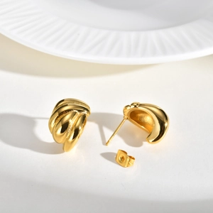 Polished gold stainless steel teardrop hoop earrings with elegant twisted croissant design
