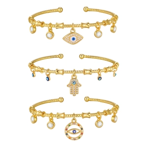 Golden Evil Eye and Hamsa Hand open cuff bracelets set with zircon charms and woven texture