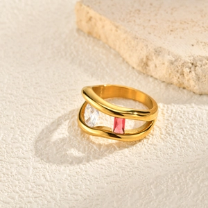 Gold wavy double band ring with white and pink zircon gemstones in polished stainless steel
