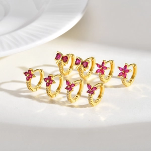 Set of four gold-plated earrings with rose red zircon flowers and butterfly charms