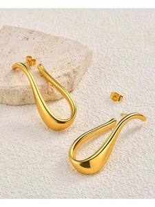 Polished 18K gold U-shaped earrings on stone base with butterfly backings