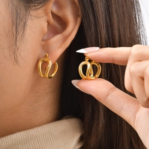 Double-layered golden U-shaped earrings with twisted texture in high-polish finish