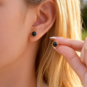 Minimalist round black stone stud earrings with golden stainless steel frames for women
