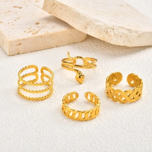 Set of four gold stainless steel rings with snake, beaded, and braided textures