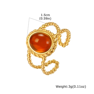 Macro view of gold ring featuring amber stone with size and weight measurements