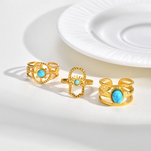 Three-piece bohemian gold-plated ring set with turquoise stones and evil eye design