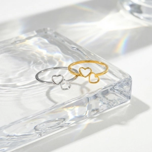 Minimalist stainless steel double heart rings in gold and silver with elegant light shadows