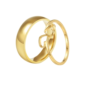 Polished gold double heart stainless steel couple ring set on white background