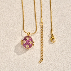 Vintage purple enamel Easter egg pendant with gold grid and crystals on snake chain