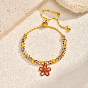 Macro shot of tricolor faceted beads with a vibrant red floral pendant on an adjustable chain