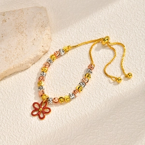 Close-up of tricolor beaded bracelet with red floral pendant and adjustable box chain