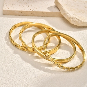 Set of four luxury 18K gold plated stainless steel bangles with zircon and shell inlay