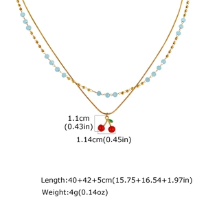 Detail showing red cherry pendant size and dimensions of the double layer gold beaded necklace