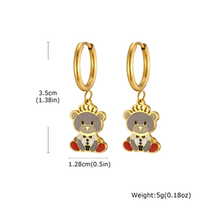 Detailed view of gold bear earrings with crown and dress charms including measurements