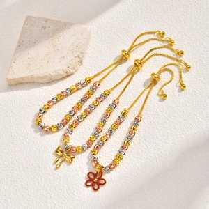 Three-piece adjustable beaded bracelet set with bow and flower pendants in tricolor finish