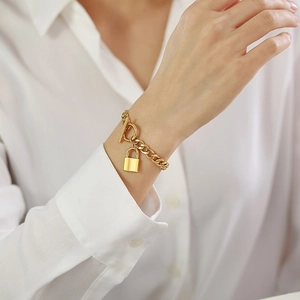 Gold stainless steel curb chain bracelet with padlock pendant and OT toggle clasp