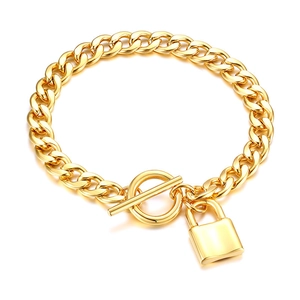 Gold stainless steel thick link chain bracelet with a lock pendant and toggle clasp