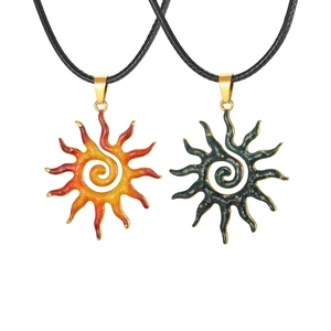 Hammered sun spiral necklaces in Christmas orange and dark green stainless steel