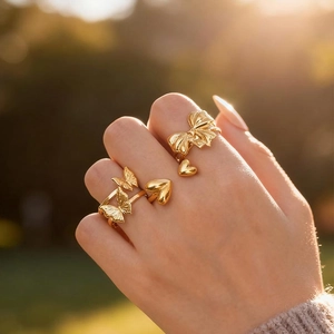 Three-piece gold butterfly and heart ring set in minimalist stainless steel for women