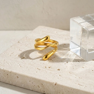 Gold wavy multi-layer teardrop stainless steel ring with a polished mirror finish