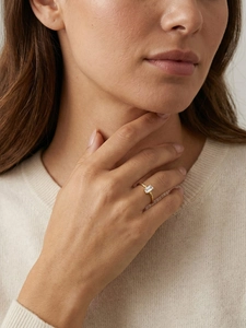 Close-up of a gold square zircon open ring worn elegantly on a model finger