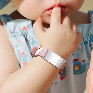 Pink silicone toddler ID bracelet with blank stainless steel nameplate and cute cow charm