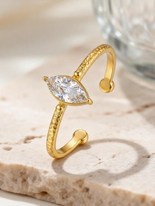 Macro view of marquise-cut zircon on hammered texture stainless steel open ring