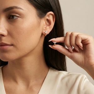 Luxurious gold-plated huggie earrings featuring a zircon clover flower butterfly design