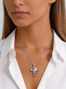 Close-up of elephant pendant necklace in silver stainless steel with a blue gemstone inlay