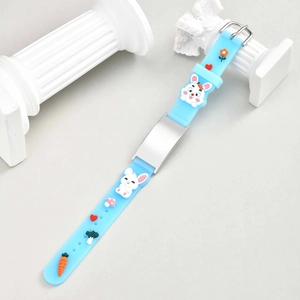 Close-up of adjustable light blue silicone kids bracelet with cute 3D cartoon charms