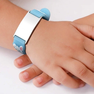 Close-up of sky blue silicone kids safety ID bracelet with stainless steel plate