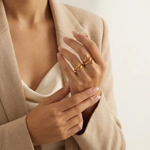 Minimalist gold tiered geometric teardrop rings set for women on model fingers
