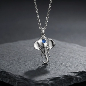 Vintage elephant head pendant necklace in silver stainless steel with blue gemstone