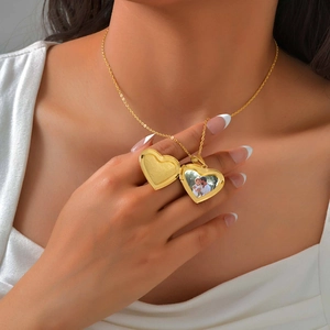 Golden heart locket necklace with openable photo frame for women on delicate chain
