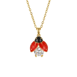Exquis collier pendentif coccinelle dorée avec ailes en émail rouge et zircone cubique