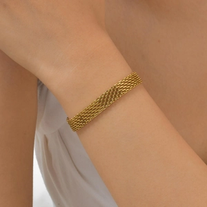Detailed view of wide gold mesh band bracelet showing intricate multi-layer chain weave
