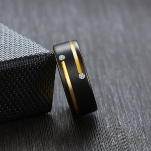 Men's black tungsten ring with gold groove and dual cubic zirconia stones