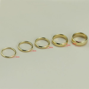 Polished gold tungsten steel rings shown in five widths from 2mm to 8mm for couples