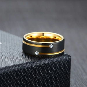 Men's tungsten carbide ring with black matte finish, gold grooves and two zircon stones