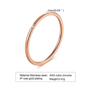 Macro shot of 1mm thin rose gold stainless steel ring featuring a tiny AAA cubic zirconia