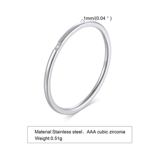 Macro detail of a 1mm thin stainless steel ring with a small AAA cubic zirconia stone