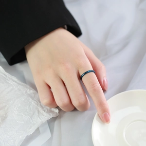 Minimalist deep blue polished tungsten ring worn on finger for daily casual styling
