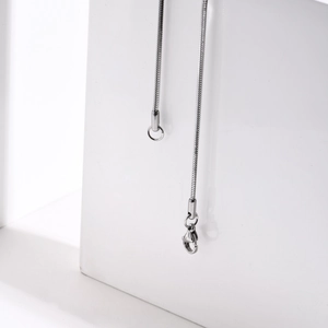 Close-up of stainless steel snake chain necklace with a secure lobster clasp