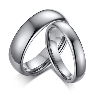 Minimalist tungsten steel polished silver couple rings with a mirror finish on white background