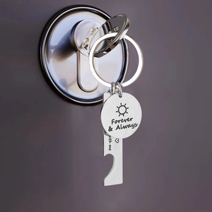 Macro view of stainless steel keychain with Forever & Always sun and heart engraving