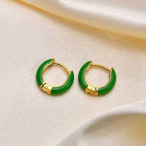 Chic gold stainless steel hoop earrings with vibrant green enamel finish on silk