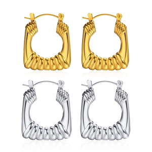 Textured gold and silver square hoop earrings with stylish horizontal wave patterns