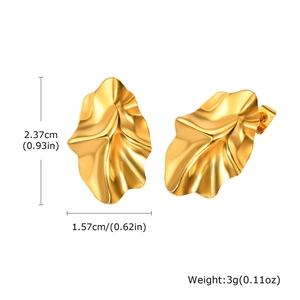 Detail view of gold irregular crinkled stud earrings with precise dimensions and weight